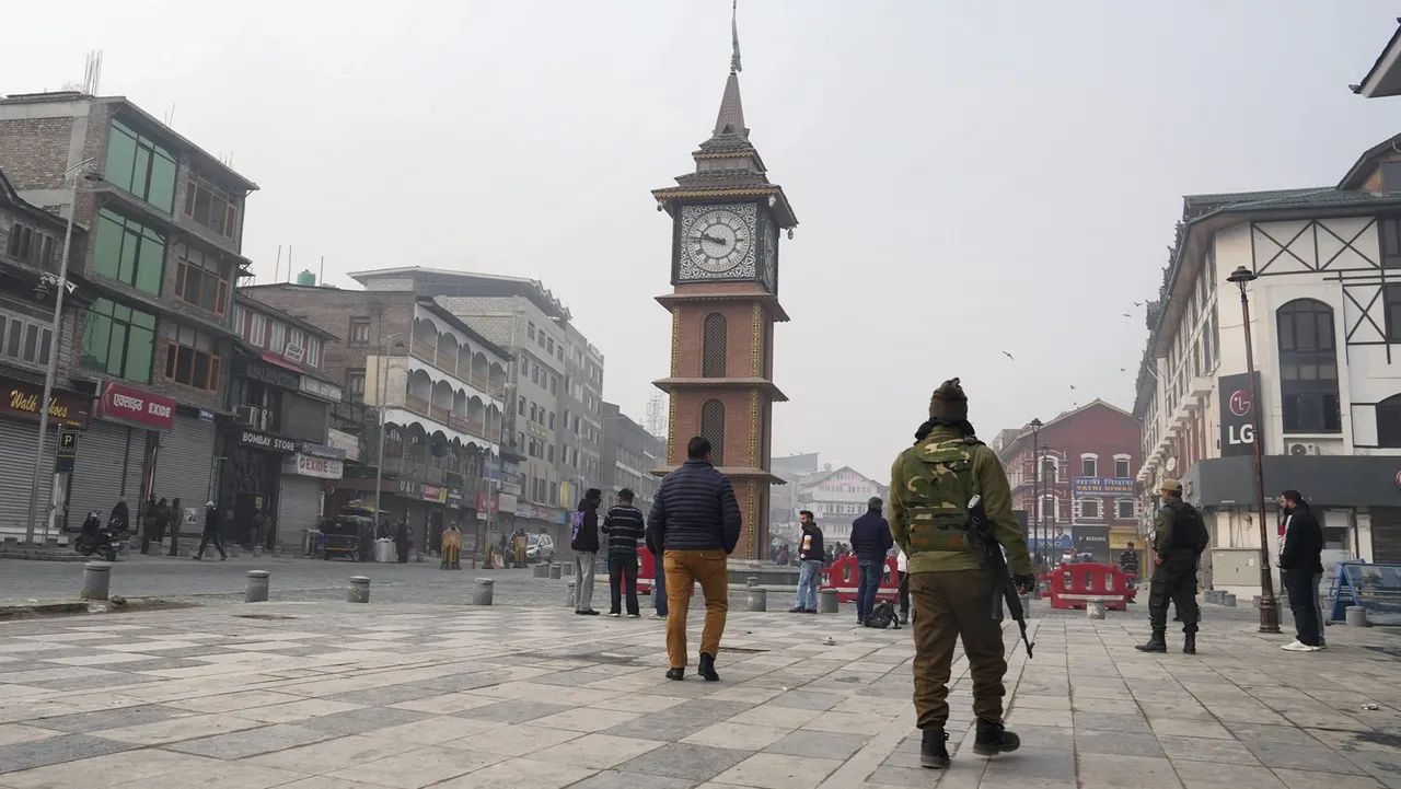 Security personnel stand guard at Lal Chowk after security was beefed up on the day of the Supreme Court's verdict