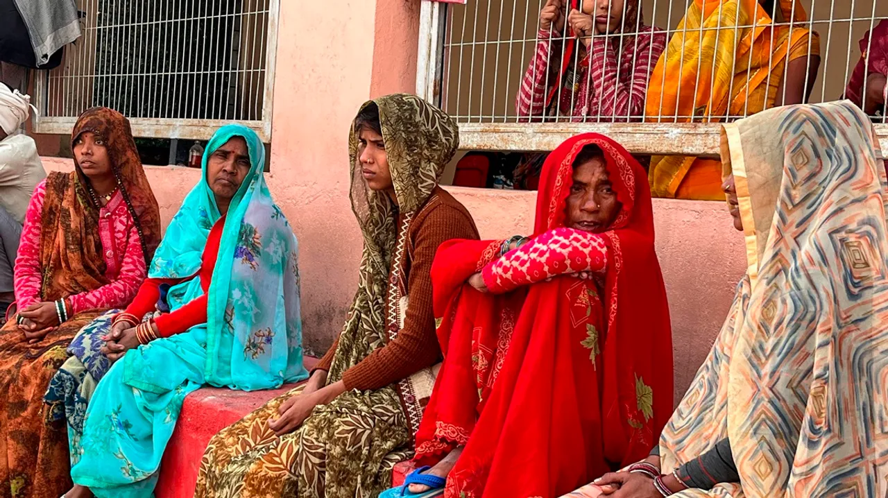 Family members wait outside the neonatal intensive care unit of the children's ward of the medical college in Jhansi on Friday