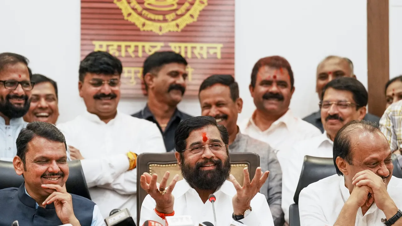 Maharashtra Chief Minister Eknath Shinde with Deputy Chief Ministers Devendra Fadnavis and Ajit Pawar celebrates the BJP-led Mahayuti alliance's lead amid the counting of votes for the Maharashtra Assembly elections, at CM's official residence 'Varsha' in Mumbai, Saturday, Nov. 23, 2024