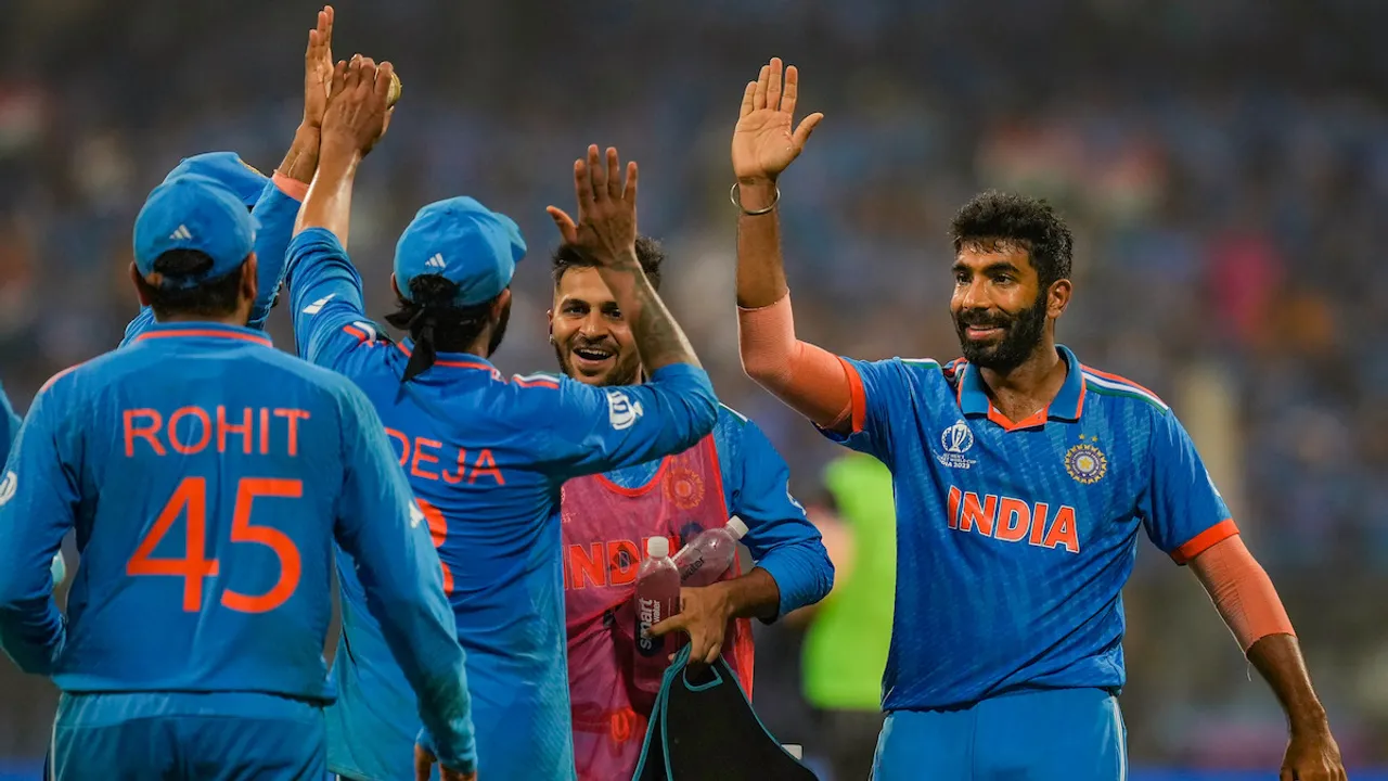 Jasprit Bumrah celebrates with captain Rohit Sharma, Ravindra Jadeja and others after taking the wicket of New Zealand's Glenn Phillips during the ICC Men's Cricket World Cup 2023 first semi-final match between India and New Zealand, at the Wankhede Stadium, in Mumbai, Wednesday, Nov. 15, 2023.