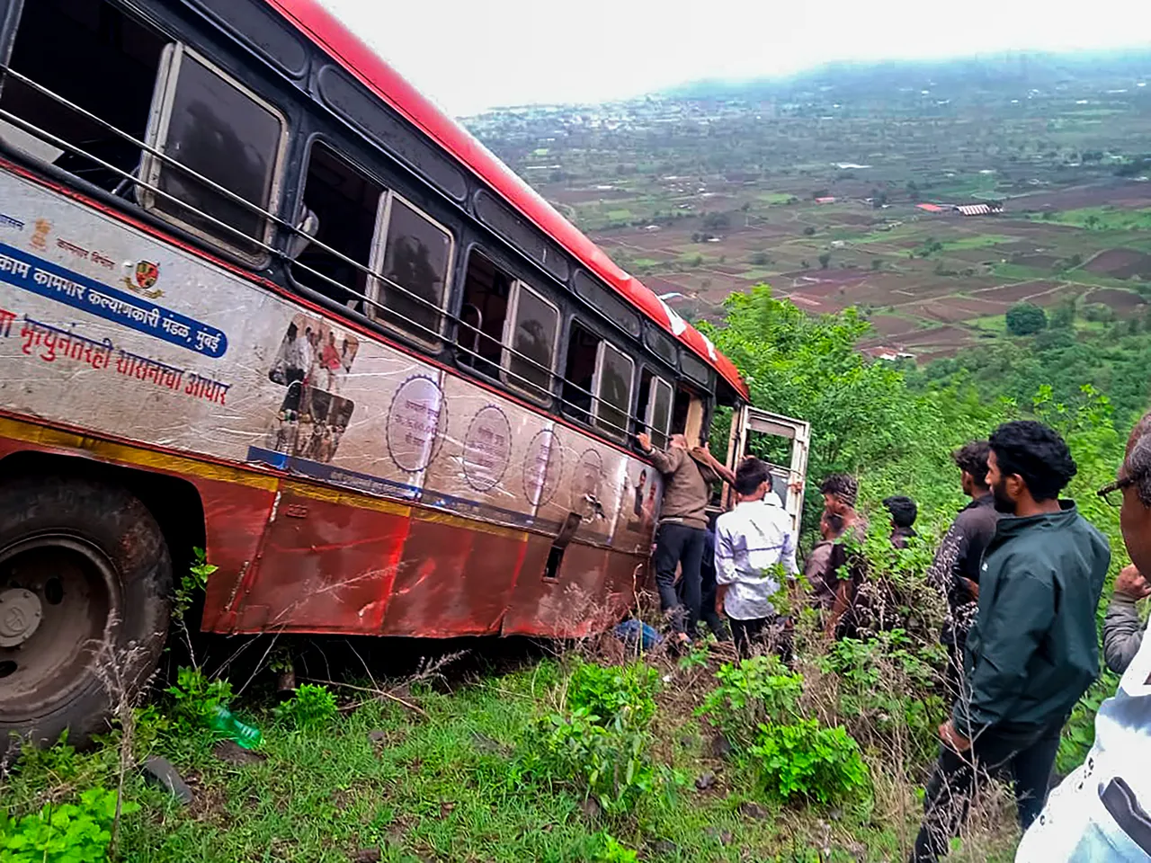 A Maharashtra State Road Transport Corporation (MSRTC) bus lies damaged after falling into a deep gorge, in Nashik district