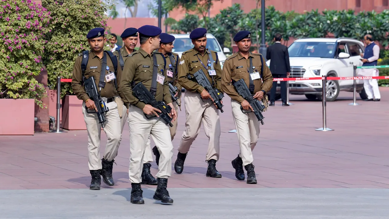 Armed security personnel patrol the Parliament House premises after a security breach