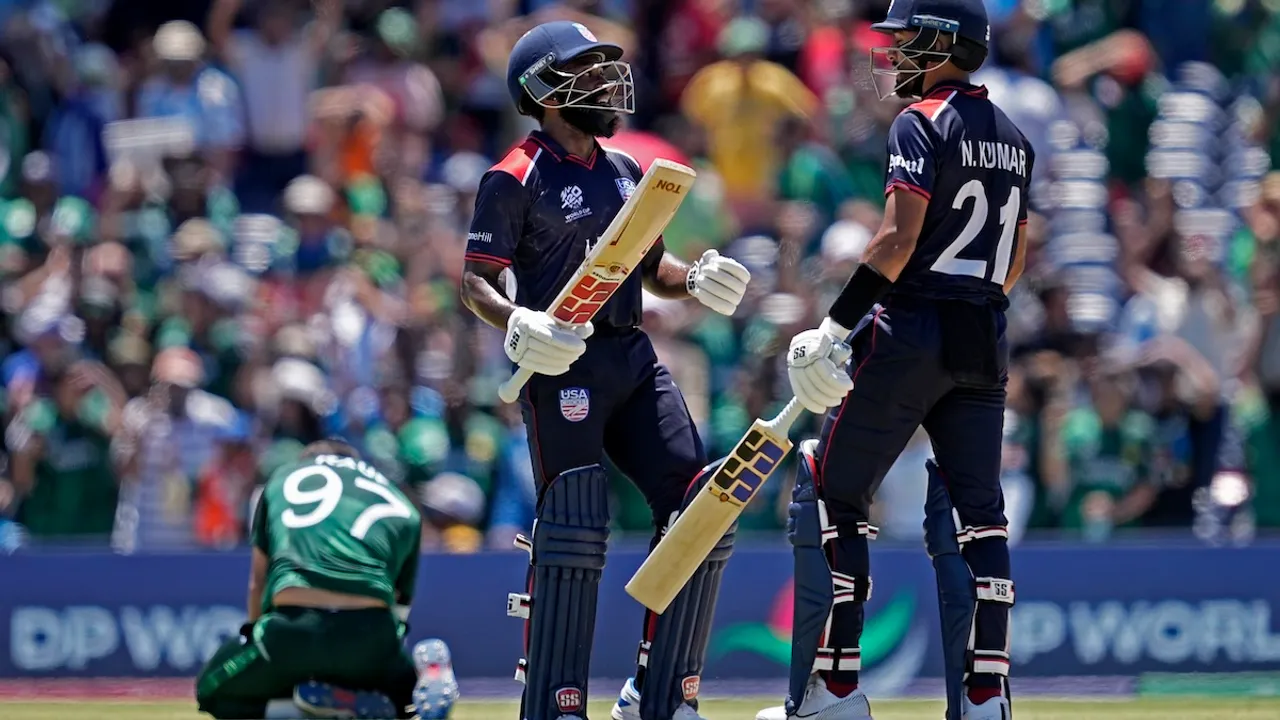 Pakistan's Haris Rauf, left, on ground, reacts as United States' Aaron Jones and Nitish Kumar, right, celebrate during the ICC Men's T20 World Cup cricket match between United States and Pakistan at the Grand Prairie Stadium in Grand Prairie, Texas, Thursday, June 6, 2024.