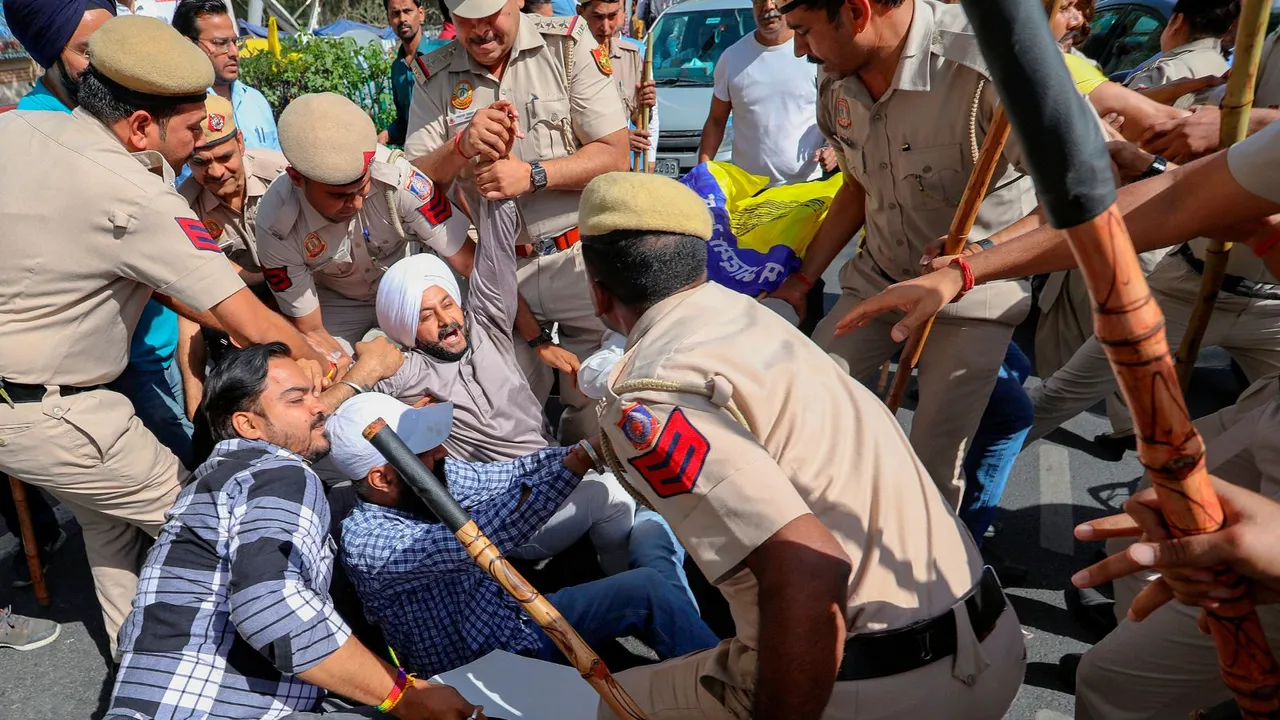 Police detain AAP supporters who were staging a protest outside the Tihar Jail in New Delhi, Monday, April 1, 2024