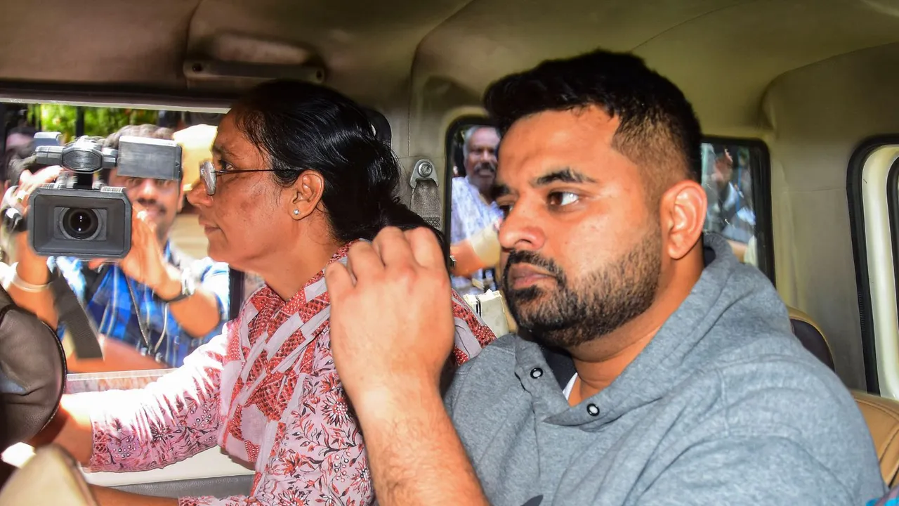 Suspended JD(S) MP Prajwal Revanna, facing allegations of sexually abusing several women, being taken to a hospital for medical examination under tight security, in Bengaluru, Friday, May 31, 2024.