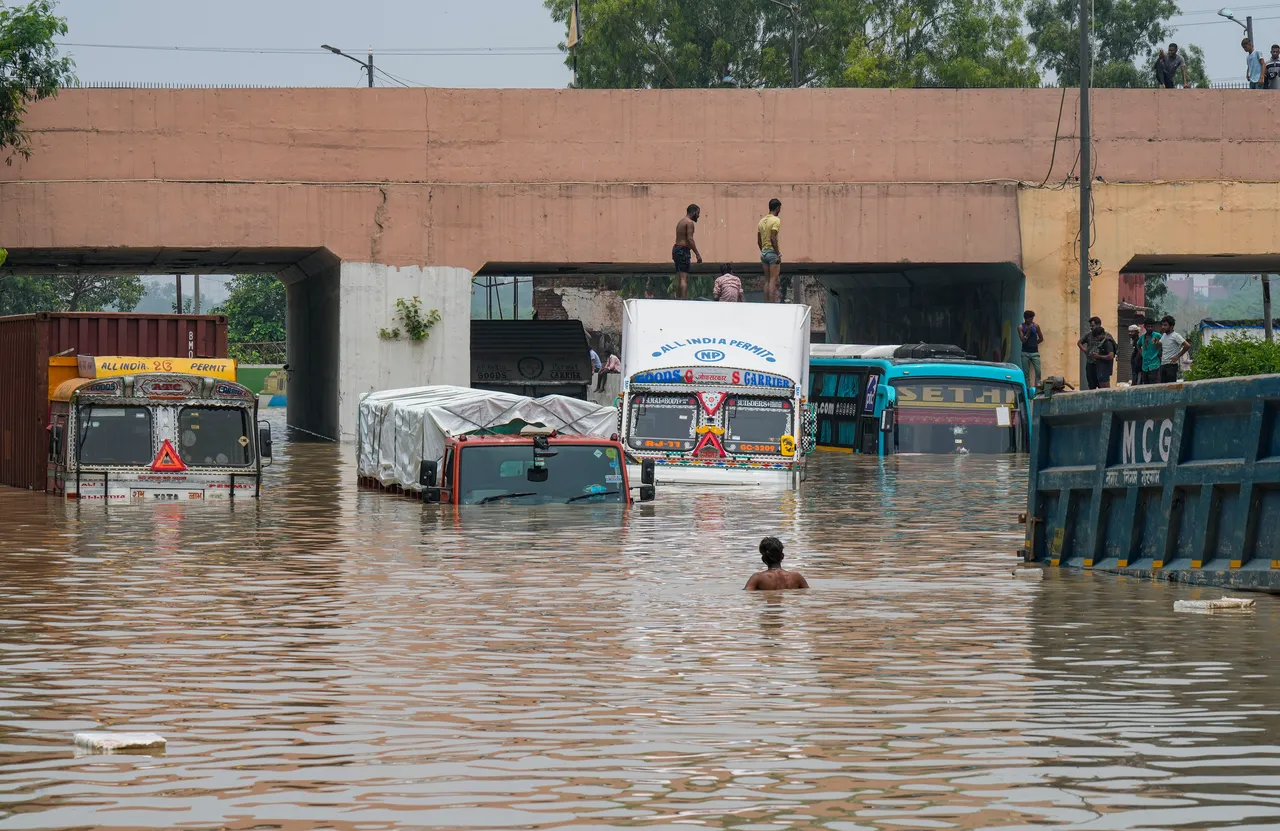 Vehicles stuck in a flooded underpass near the Old Yamuna Bridge (Loha Pul), in New Delhi