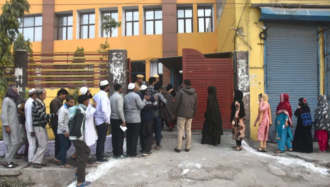 Voters wait for their turn to cast their votes in MCD polls