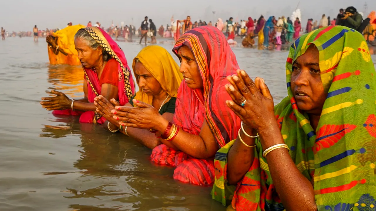 Pilgrims offer prayer during Gangasagar Mela, in South 24 Parganas district