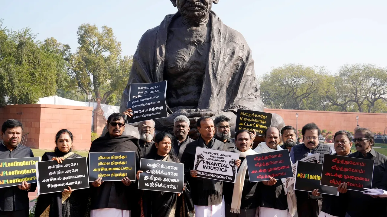 DMK MPs TR Baalu, Kanimozhi and others stage protest at the Gandhi statue at the Parliament House complex