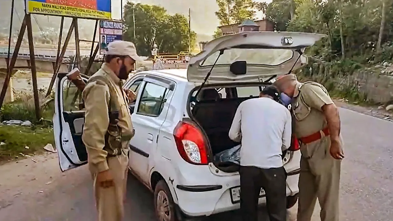 Security personnel check a vehicle during a search operation after one soldier was killed and four were injured as terrorists ambushed an Indian Air Force (IAF) convoy on Saturday, in Pooch district, Sunday, May 5, 2024