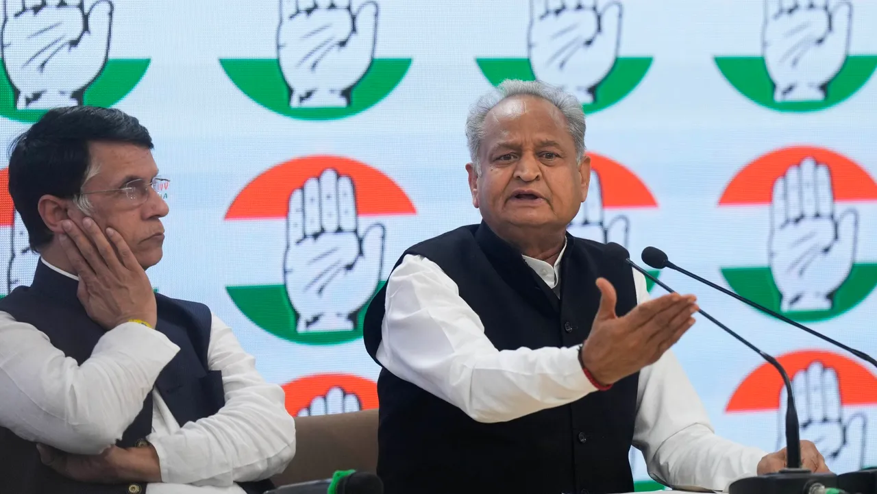 Senior Congress leader and Rajasthan Chief Minister Ashok Gehlot with party leader Pawan Khera addresses the media at AICC Hq., in New Delhi