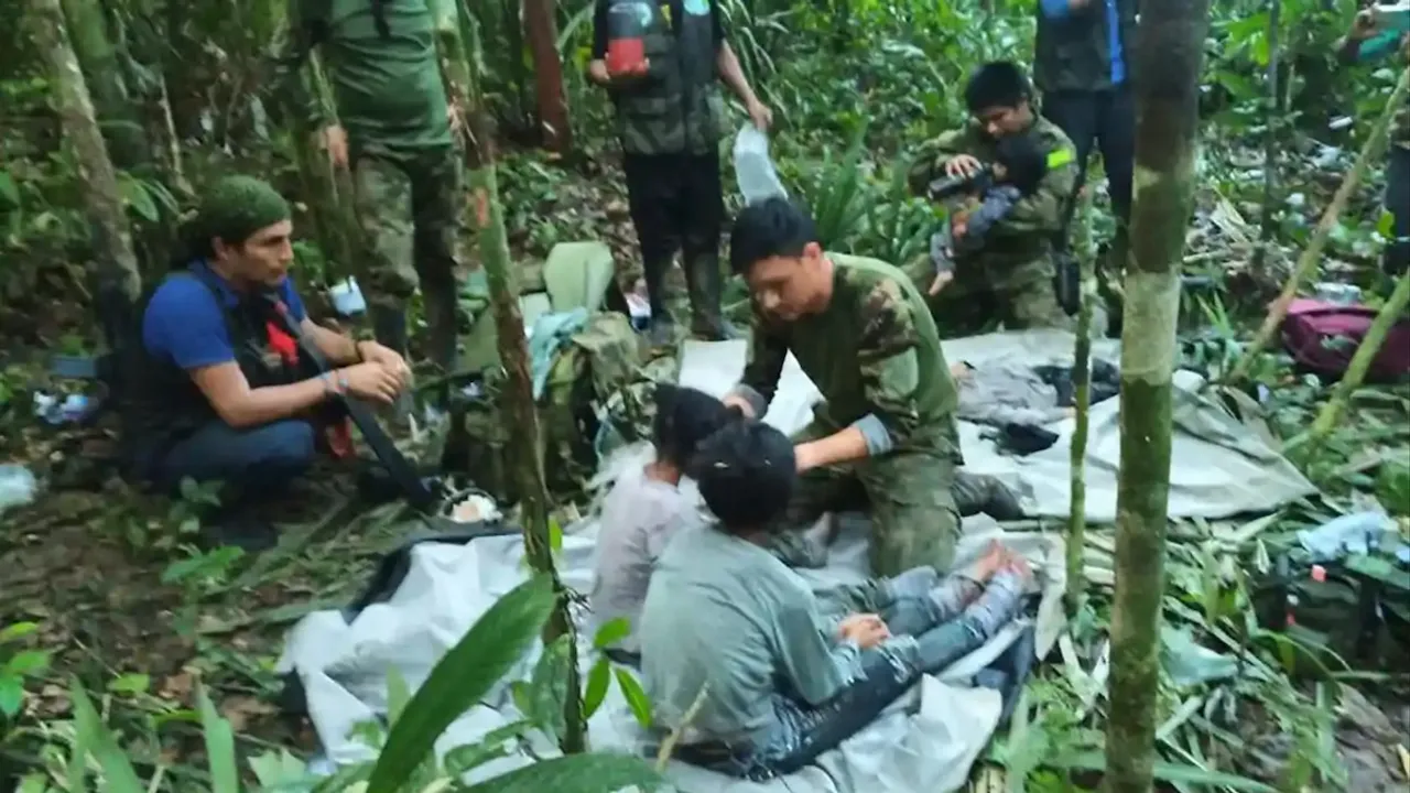 Colombian soldiers attend to the children rescued from the plane that crashed in the jungle of Caqueta