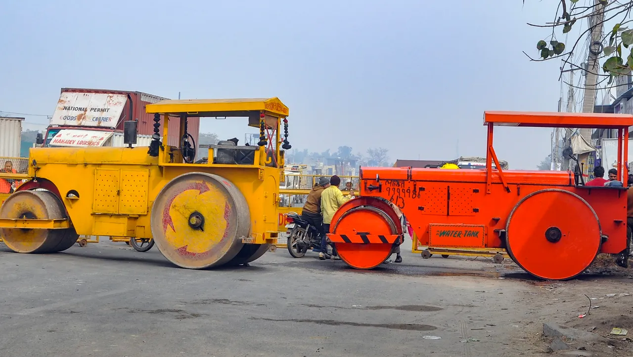 Road rollers, acting as a barricade, parked near Singhu border in view of farmers' 'Delhi Chalo March',
