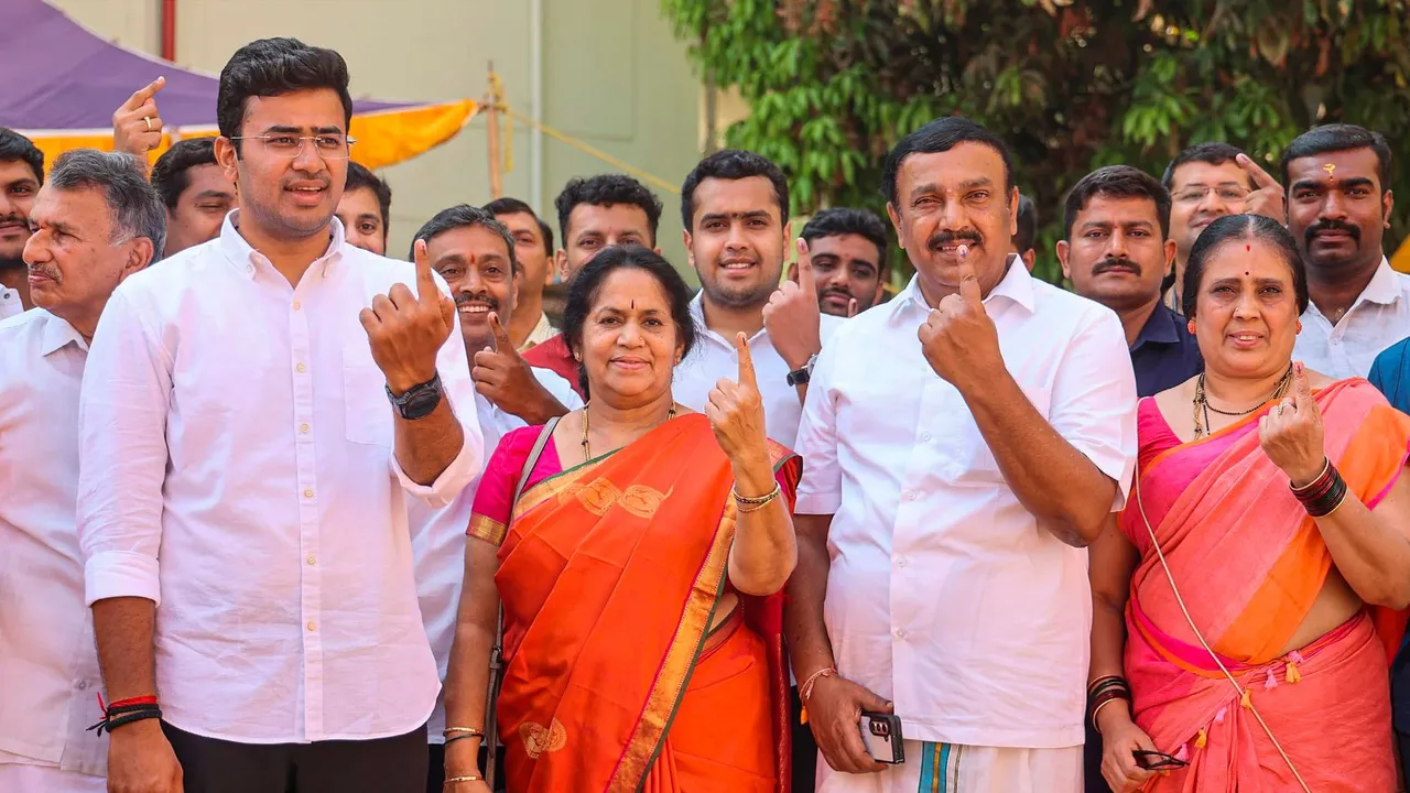 Bengaluru South constituency BJP candidate Tejasvi Surya and MLA Ravi Subramanyam with family members show their fingers marked with indelible ink after casting votes for the 2nd phase of Lok Sabha elections, in Bengaluru