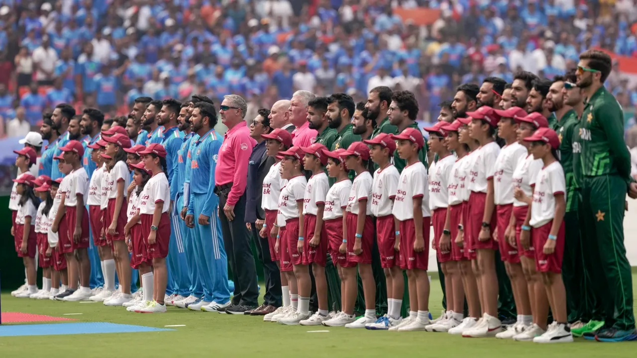 Indian and Pakistan team stand during the national anthem before the ICC Men's Cricket World Cup 2023 match between India and Pakistan, at Narendra Modi Stadium, in Ahmedabad