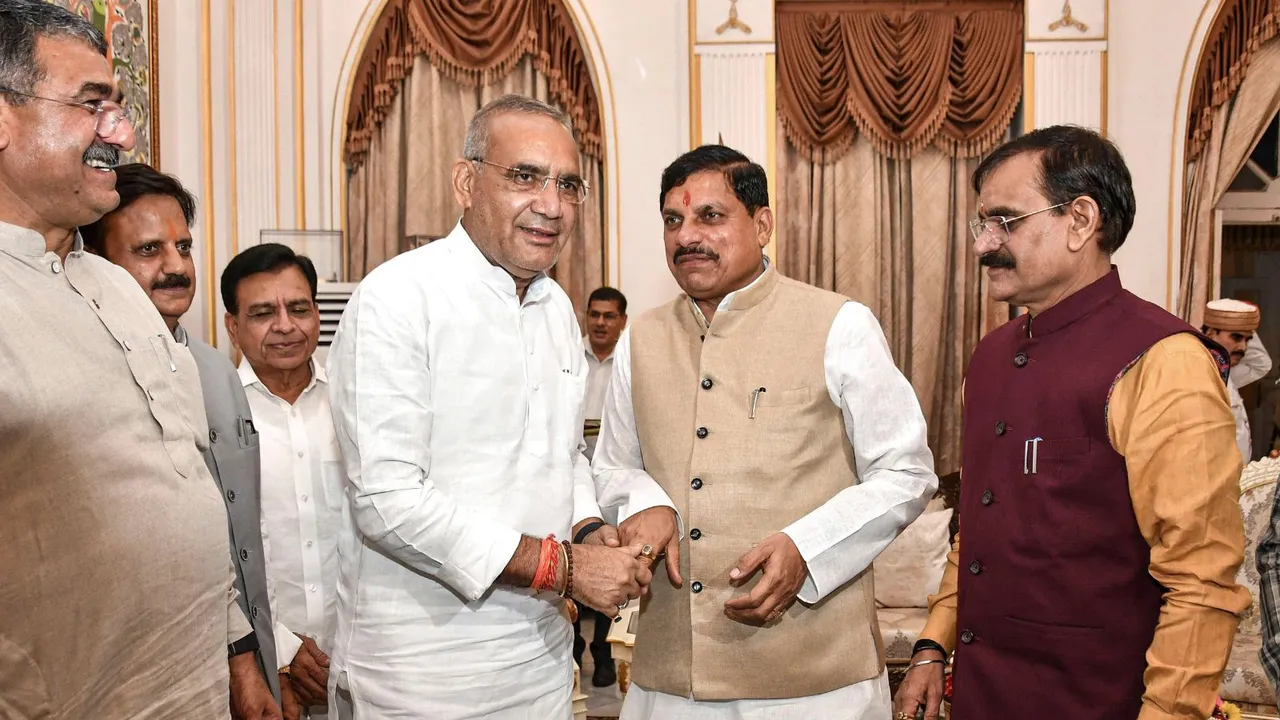 Madhya Pradesh Chief Minister Mohan Yadav greets five-time MLA from Vijaypur constituency, Ramniwas Rawat after he took oath as a Cabinet minister at a ceremony at Raj Bhawan, in Bhopal, Monday, July 8, 2024.