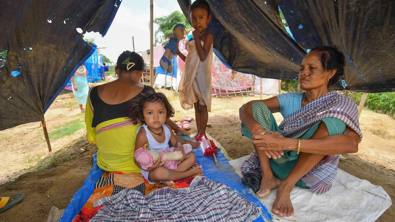 Residents of flood affected areas take shelter at a relief camp, near Patiapam village, in Nagaon district, Sunday, July 7, 2024.