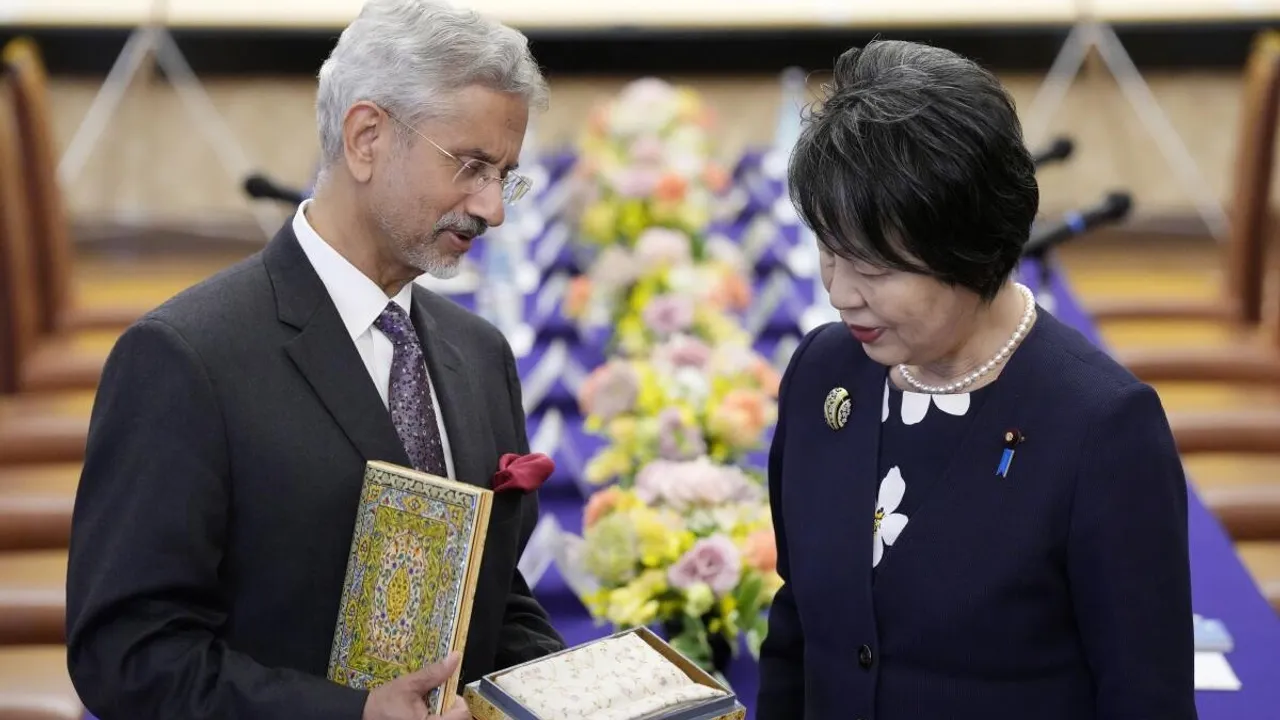 Indian Foreign Minister Subrahmanyam Jaishankar, left, gives an Indian gift to his Japanese counterpart, Yoko Kamikawa, before their meeting at Iikura Guest House Thursday, March 7, 2024, in Tokyo