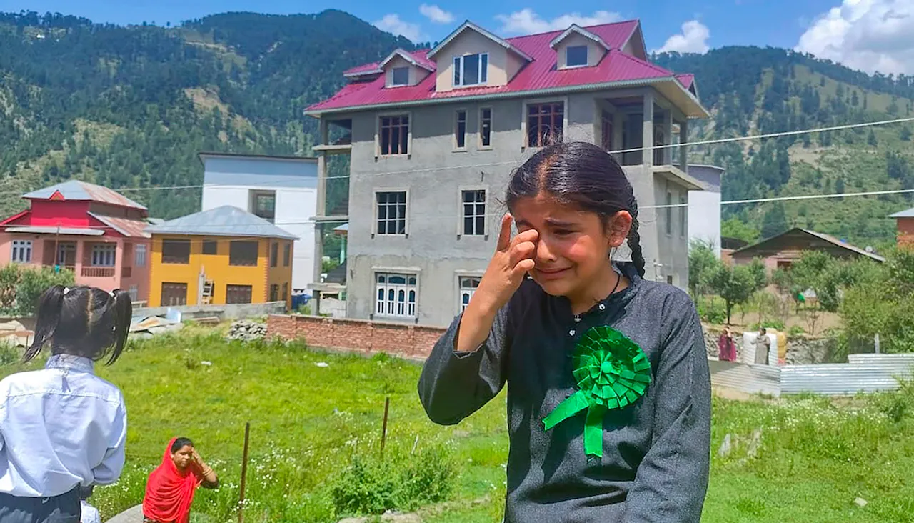 A school student cries in panic after a massive earthquake struck Chenab region, in Doda, Tuesday, June 13, 2023. Dozens of government buildings, shopping complexes and offices got partially damaged after the tremor.