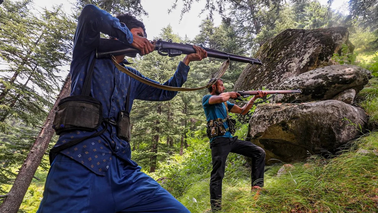 Village Defence Guards keep vigil at a forest area near the encounter site, in Desa area of Doda district, Jammu and Kashmir, Wednesday, July 17, 2024