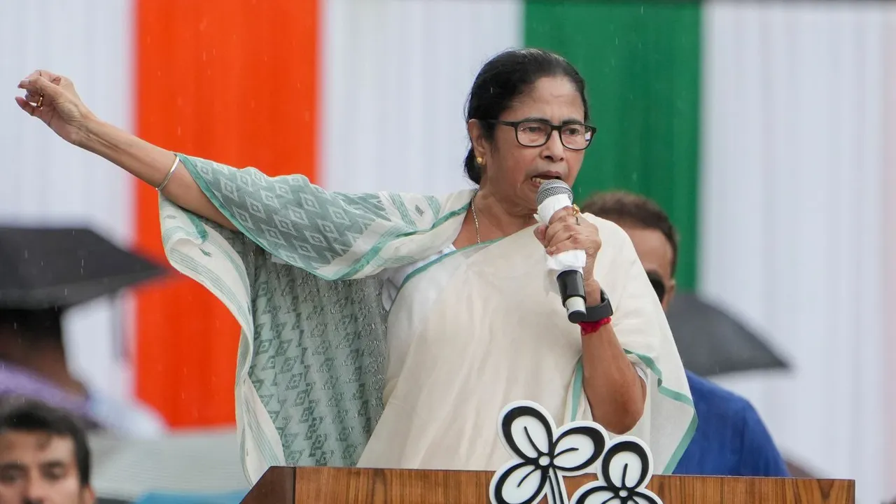 West Bengal Chief Minister Mamata Banerjee addresses the gathering during TMC Martyr's Day rally amid rain, in Kolkata, Sunday, July 21, 2024.