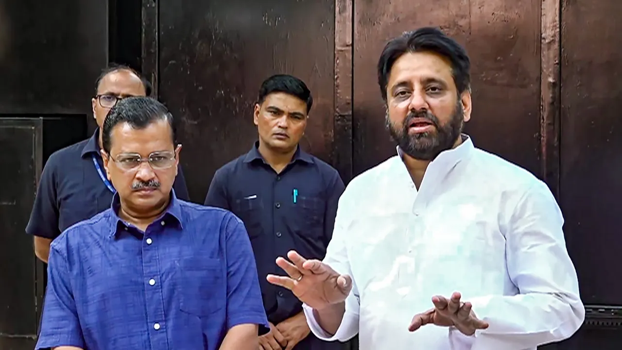 Delhi Chief Minister Arvind Kejriwal with AAP MLA Amanatullah Khan addresses a press conference outside his residence after ED’s raid at Khan’s premises, in New Delhi