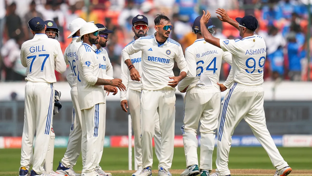 Axar Patel celebrates with team mates after taking the wicket of England's batter Ben Foakes