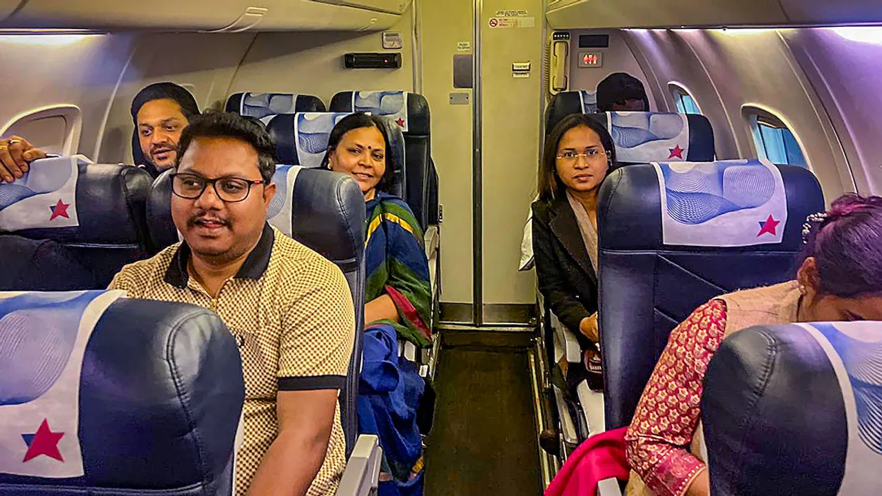 MLAs of Jharkhand Mukti Morcha-led ruling alliance who were taken to Hyderabad, onboard a flight back to Ranchi, on Sunday, Feb. 4, 2024.