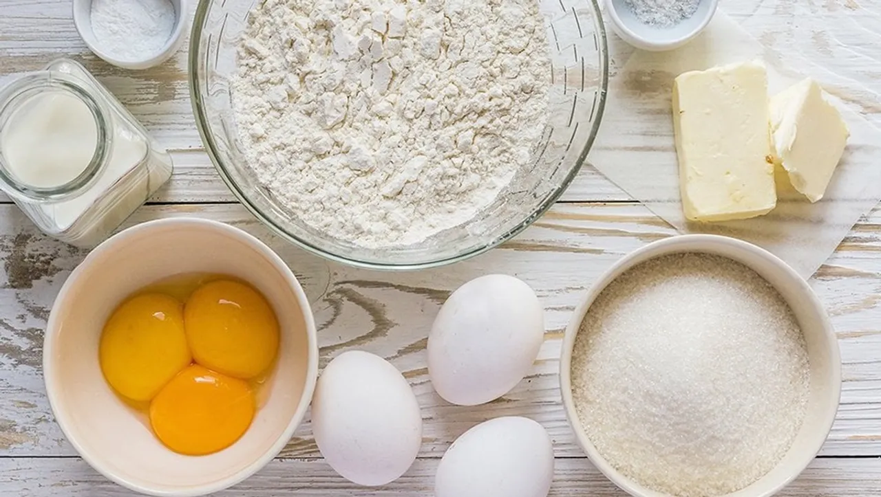 Butter eggs sugar flour on a table