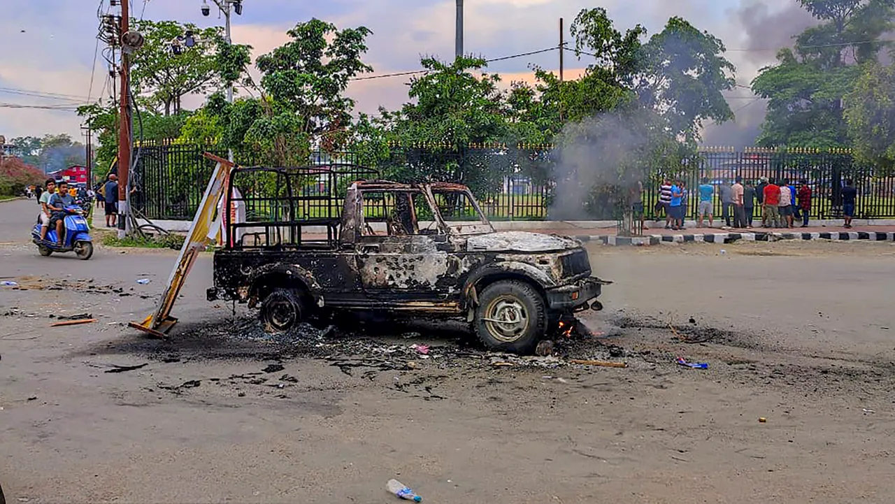 Charred remains of a vehicle that was set ablaze after violence broke out during the 'Tribal Solidarity March' called by All Tribal Student Union Manipur (ATSUM) in Imphal on May 4