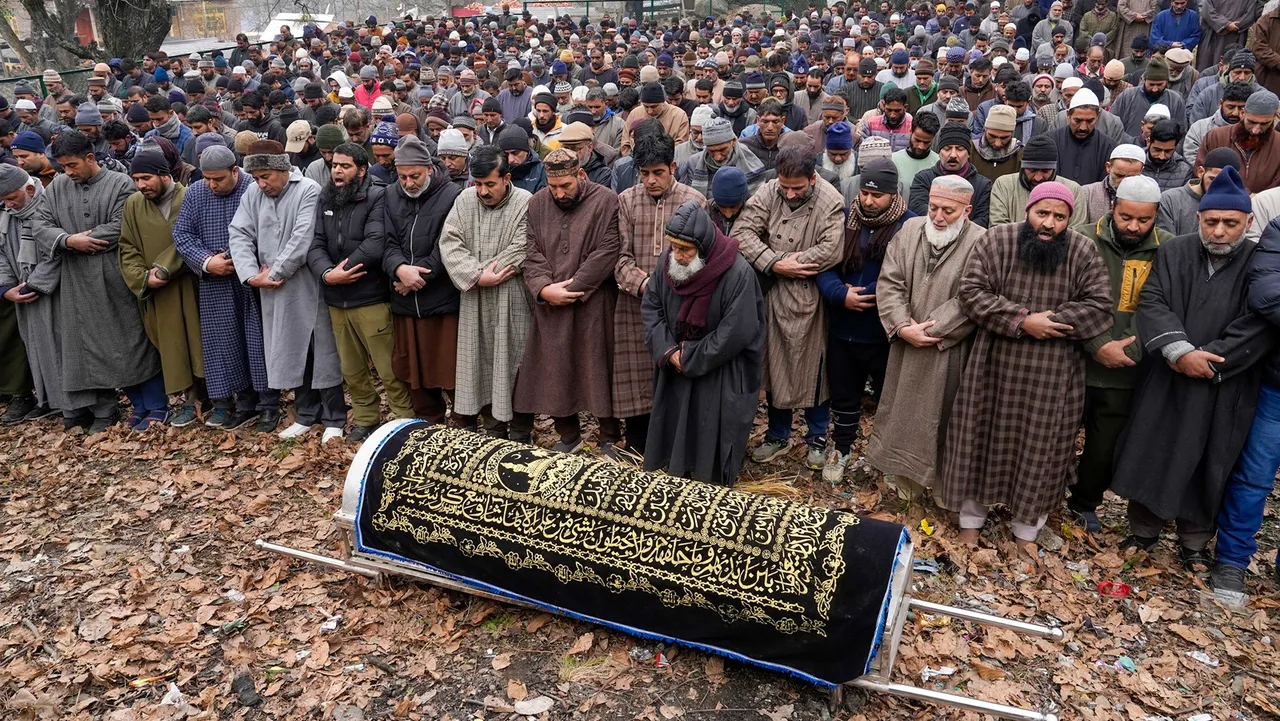 People offer funeral prayers for retired police officer who was killed by unknown militants at Gantamulla area of Baramulla