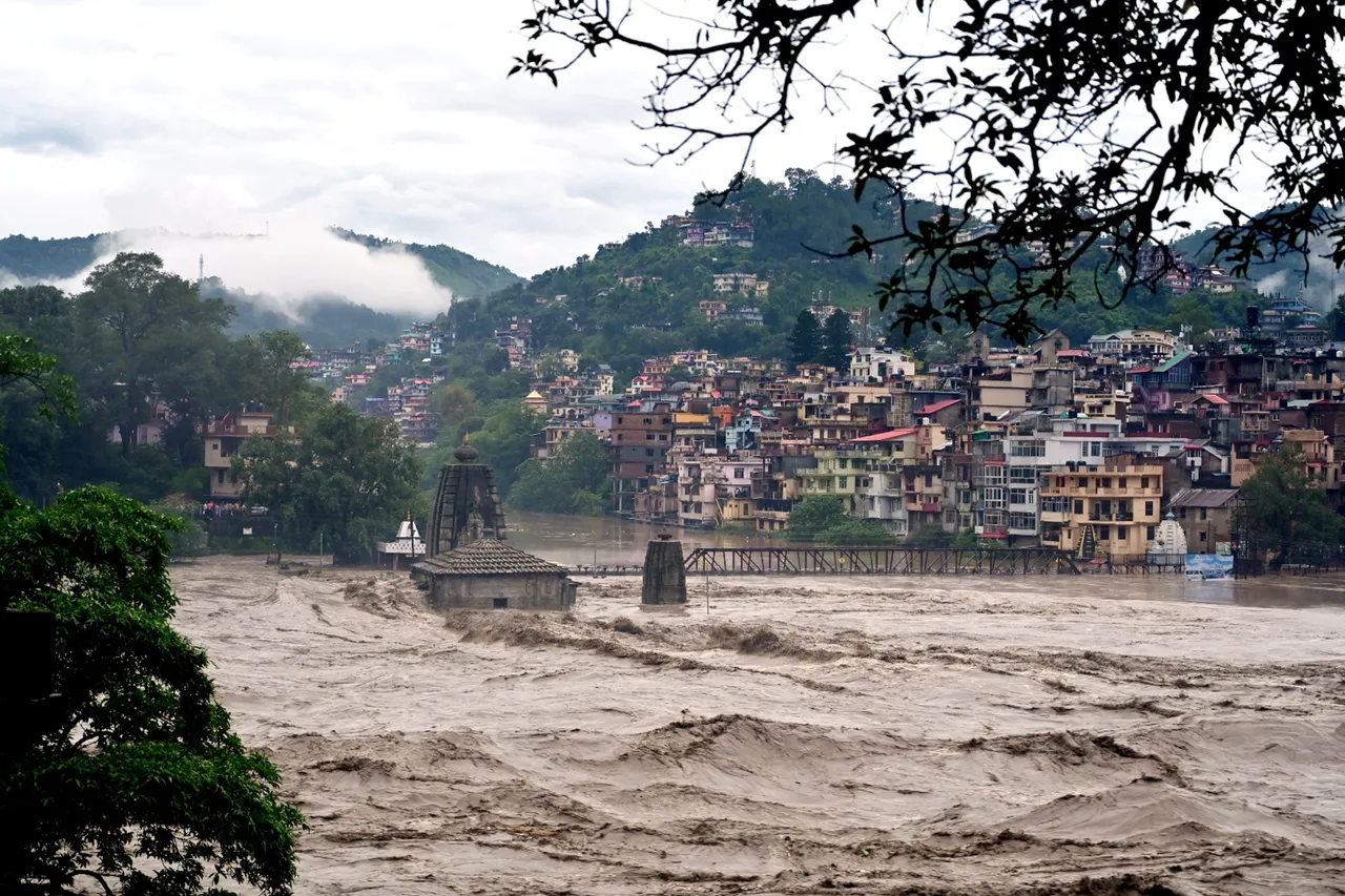 Submerged Panchvaktra Temple in swollen Beas river due to heavy monsoon rainfall, in Mandi district, Sunday.jpg