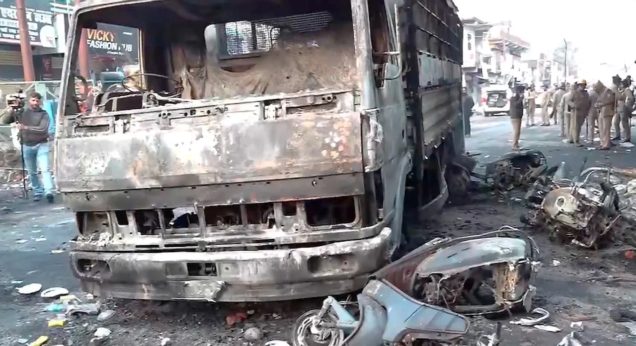 Charred remains of vehicles lie on a road after local residents on Thursday set vehicles and a police station on fire and hurled stones, injuring more than 60 people, over the demolition of illegally-built madrasa and an adjoining mosque, in Haldwani, Friday, Feb. 9, 2024.