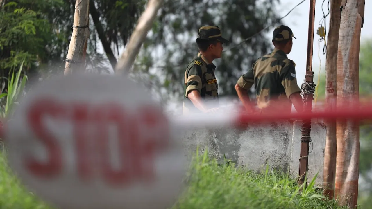 BSF personnel patrol near the international border after foiling an infiltration attempt in Arnia sector on the outskirts of Jammu, Monday, July 31