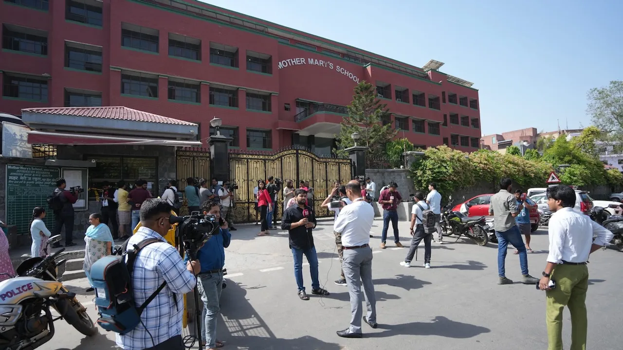Media personnel outside Mother Mary School, Mayur Vihar, after multiple schools received a bomb threat, in New Delhi, Wednesday, May 1, 2024.