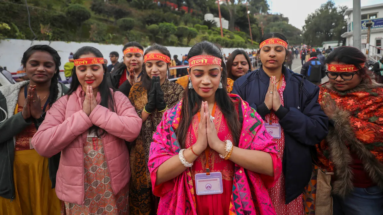 Devotees pray outside the Darshani Deodi on their way to Mata Vaishno Devi shrine, on the first day of the New Year 2023, at Katra