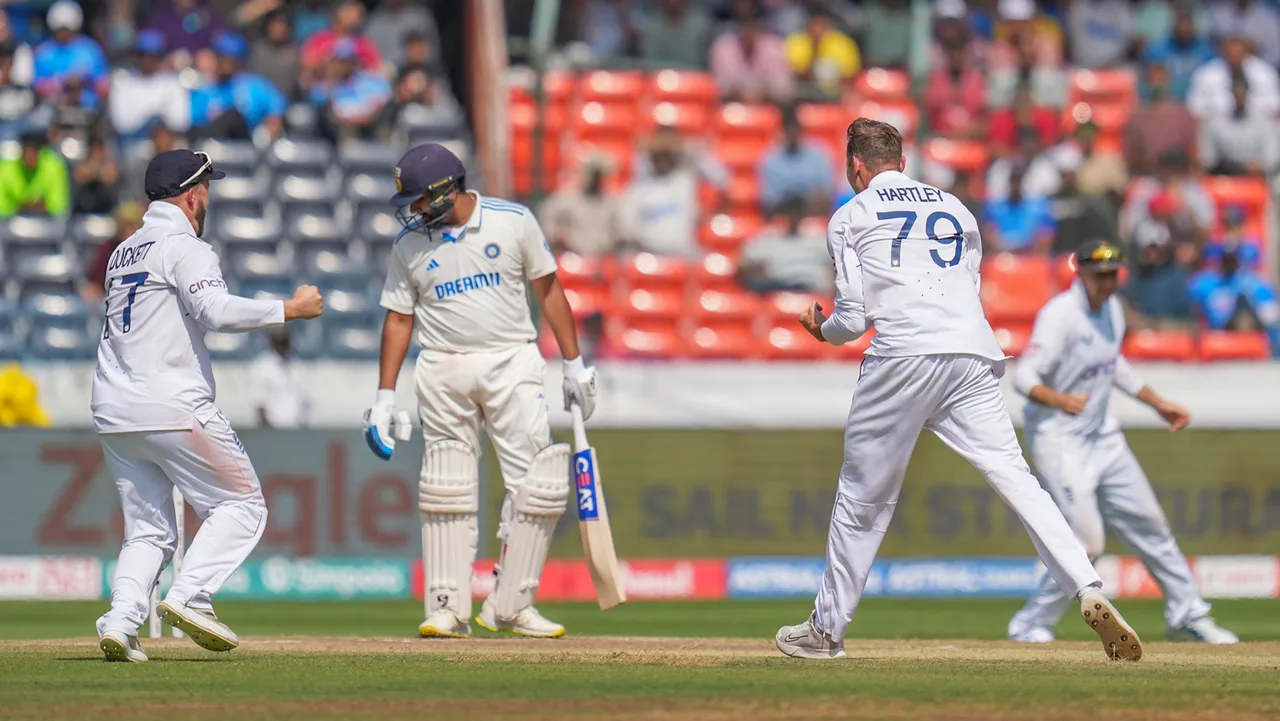 Tom Hartley celebrates the wicket of India's batter Rohit Sharma during the fourth day of the first Test cricket match between India and England