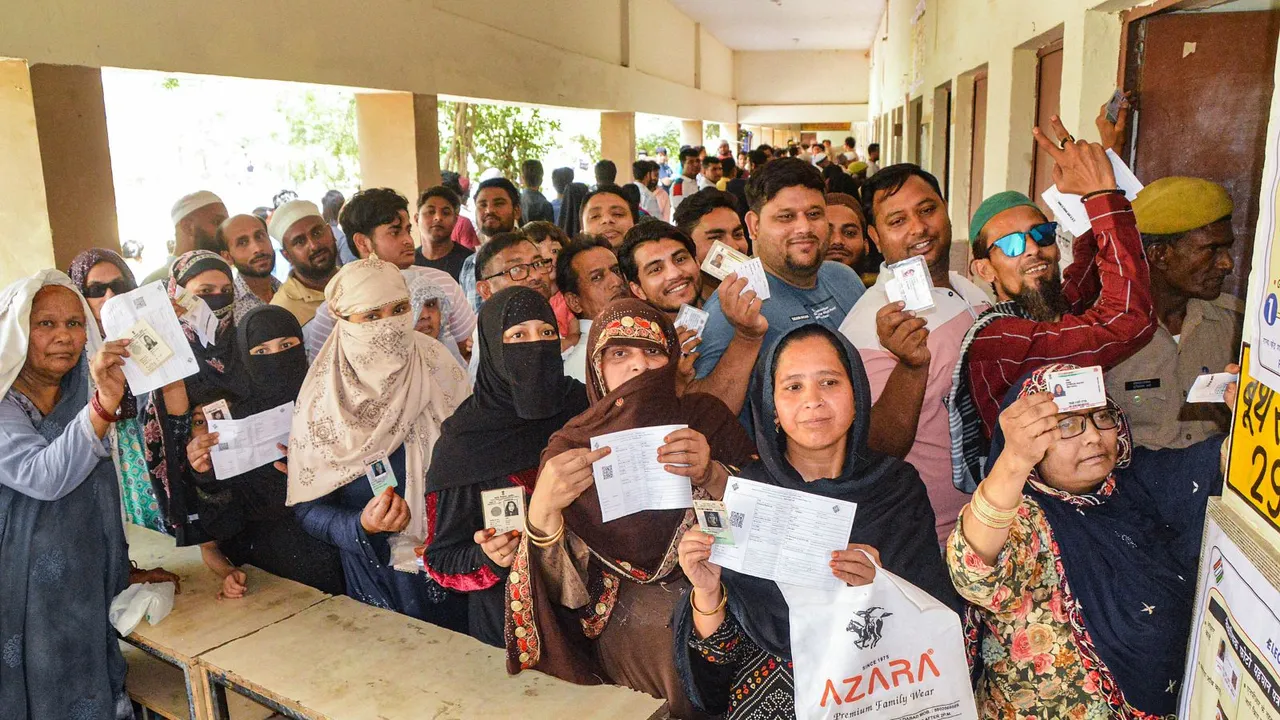 People show their ID cards as they arrive to cast their votes for the second phase of Lok Sabha elections, in Ghaziabad, Friday, April 26, 2024