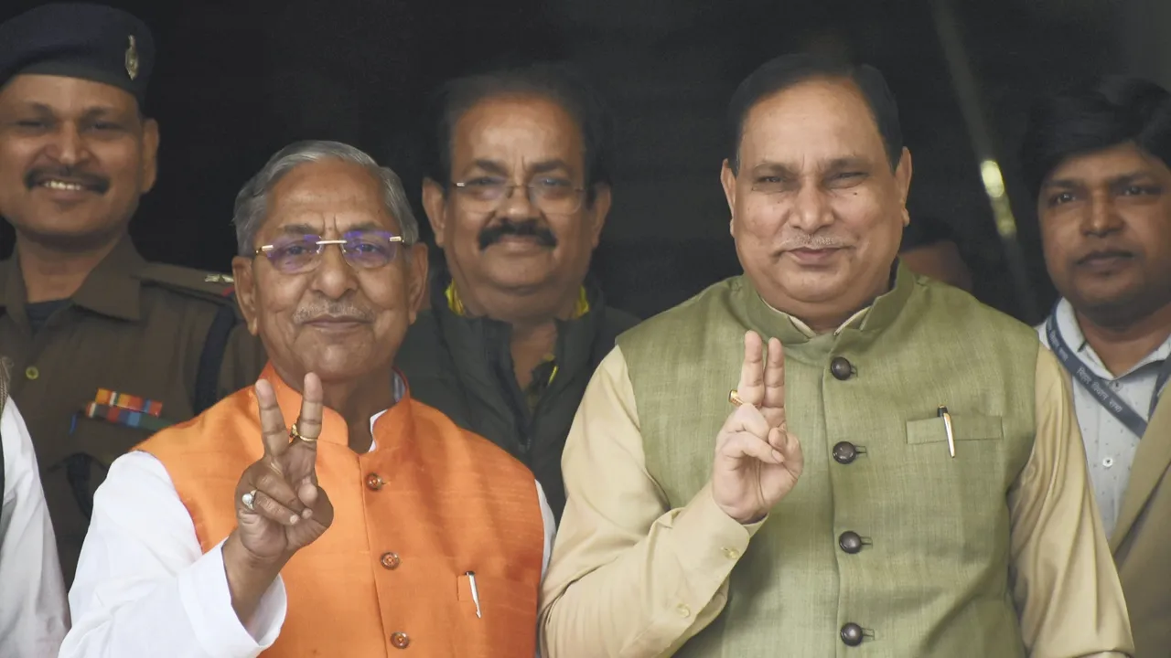 Newly elected Bihar Assembly Speaker Nand Kishore Yadav (C) and deputy Speaker Maheshwar Hazari show victory sign