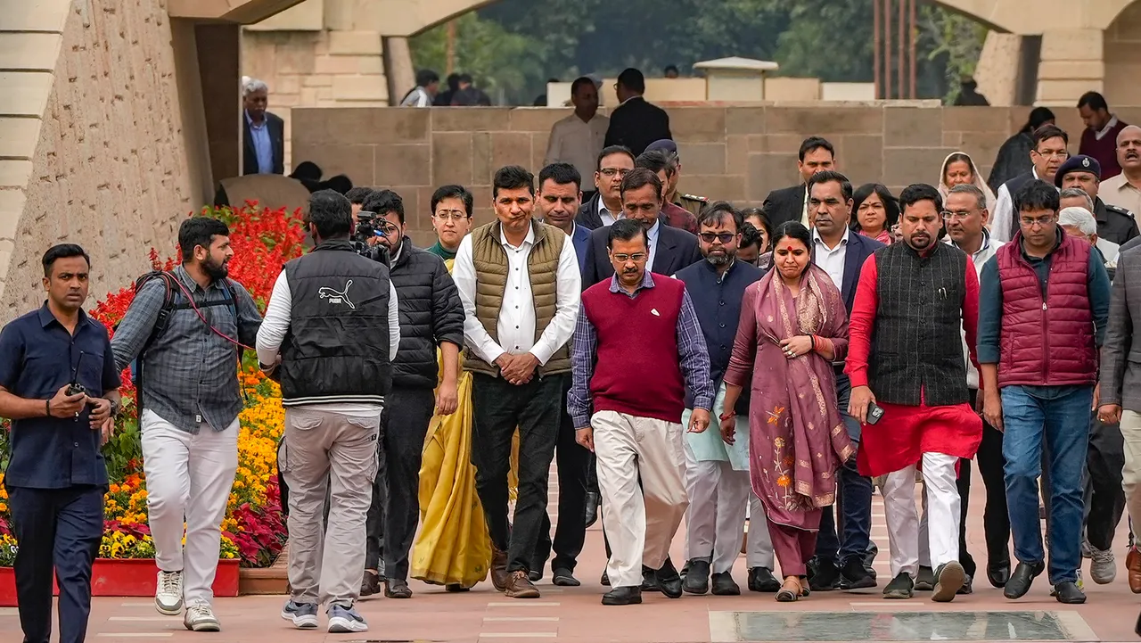 Delhi Chief Minister and AAP leader Arvind Kejriwal with cabinet ministers and party legislators leaves after visiting Rajghat to mark one year of party leader Manish Sisodia's arrest, in New Delhi