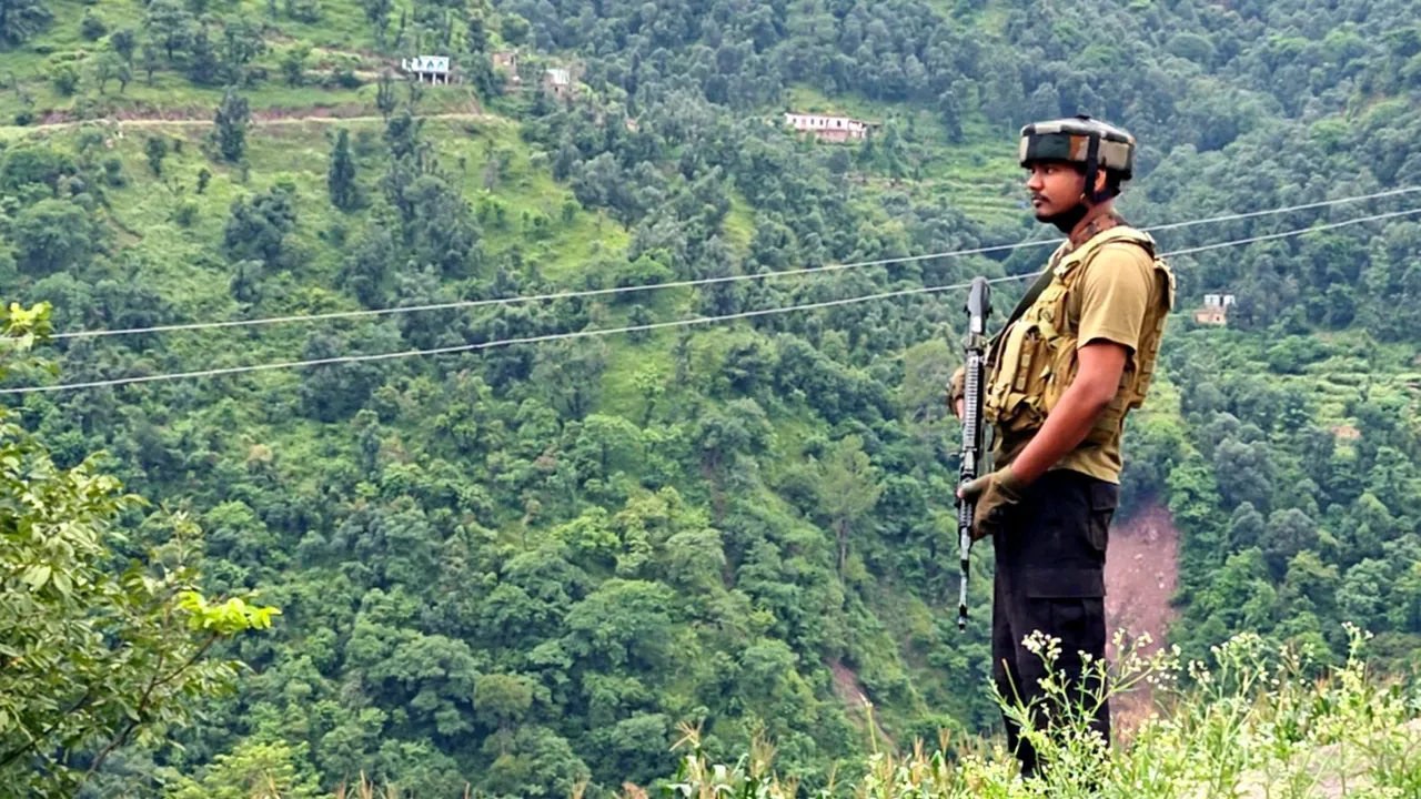 A security personnel keeps vigil during pre-dawn cordon and search operation after reports of suspicious movement, leading to an exchange of fire, in Rajouri district, Thursday, Aug 29, 2024.