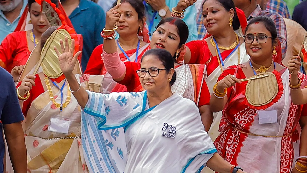 West Bengal Chief Minister Mamata Banerjee greets supporters during an election roadshow for the Lok Sabha polls, in Howrah, Wednesday, May 15, 2024. 