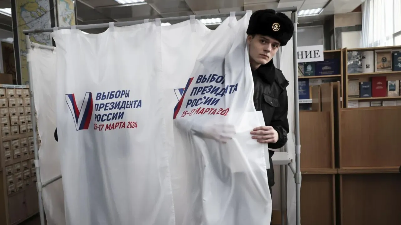 A student of the Maritime State University, Gennady Nevelskoy, leaves a voting booth at a polling station in Vladivostok, Russia, on Friday