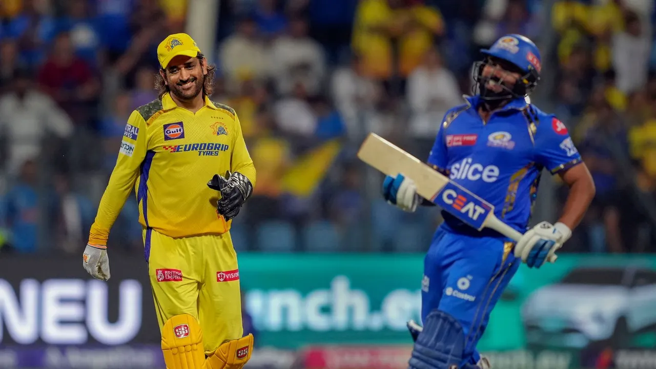 Chennai Super Kings player MS Dhoni and Mumbai Indians player Rohit Sharma at the end of the Indian Premier League (IPL) cricket match between Chennai Super Kings and Mumbai Indians