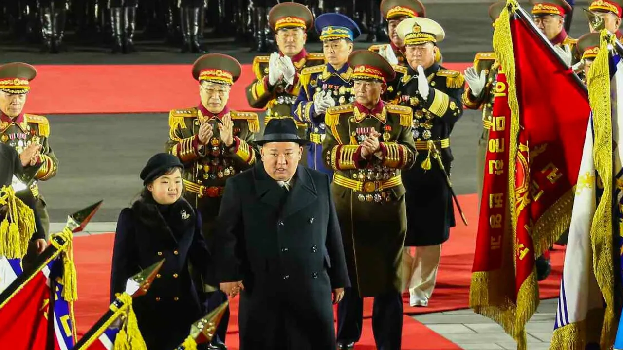 Kim Jong Un shows off daughter, nuclear missiles at military parade