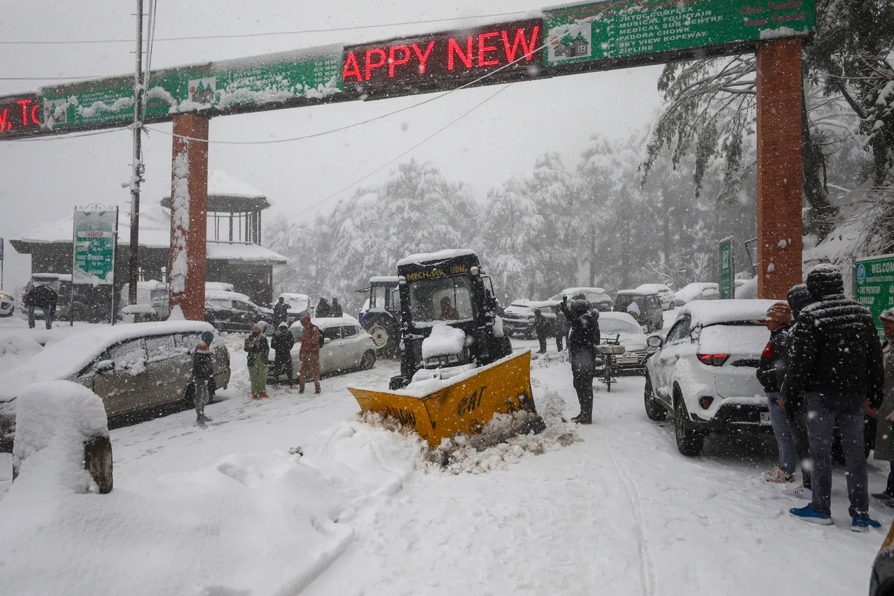 A snow clearing machine being used to remove snow from Jammu-Srinagar national highway, near Patnitop hill station, in Jammu & Kashmir