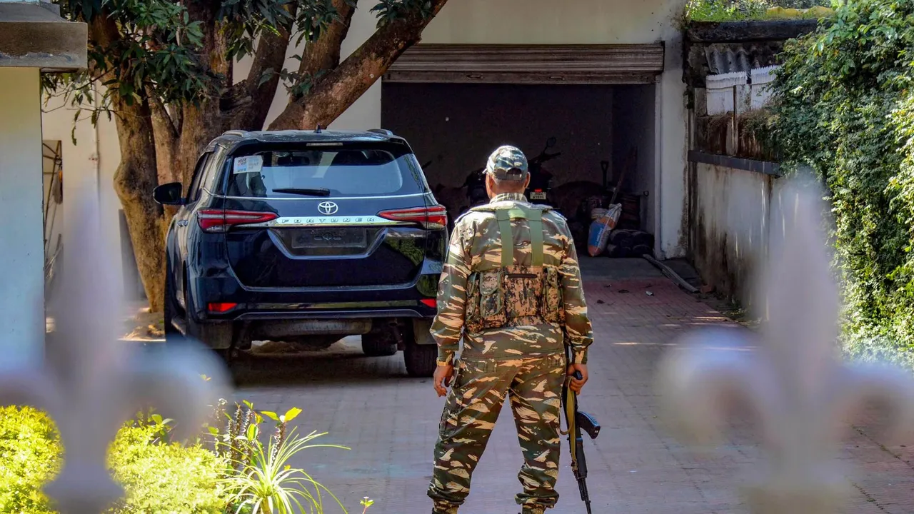 A Central Reserve Police Force (CRPF) jawan stands guard inside the premises of Jharkhand Congress MLA Amba Prasad where the Enforcement Directorate (ED) officials conduct a raid in connection with multiple cases, in Ranchi