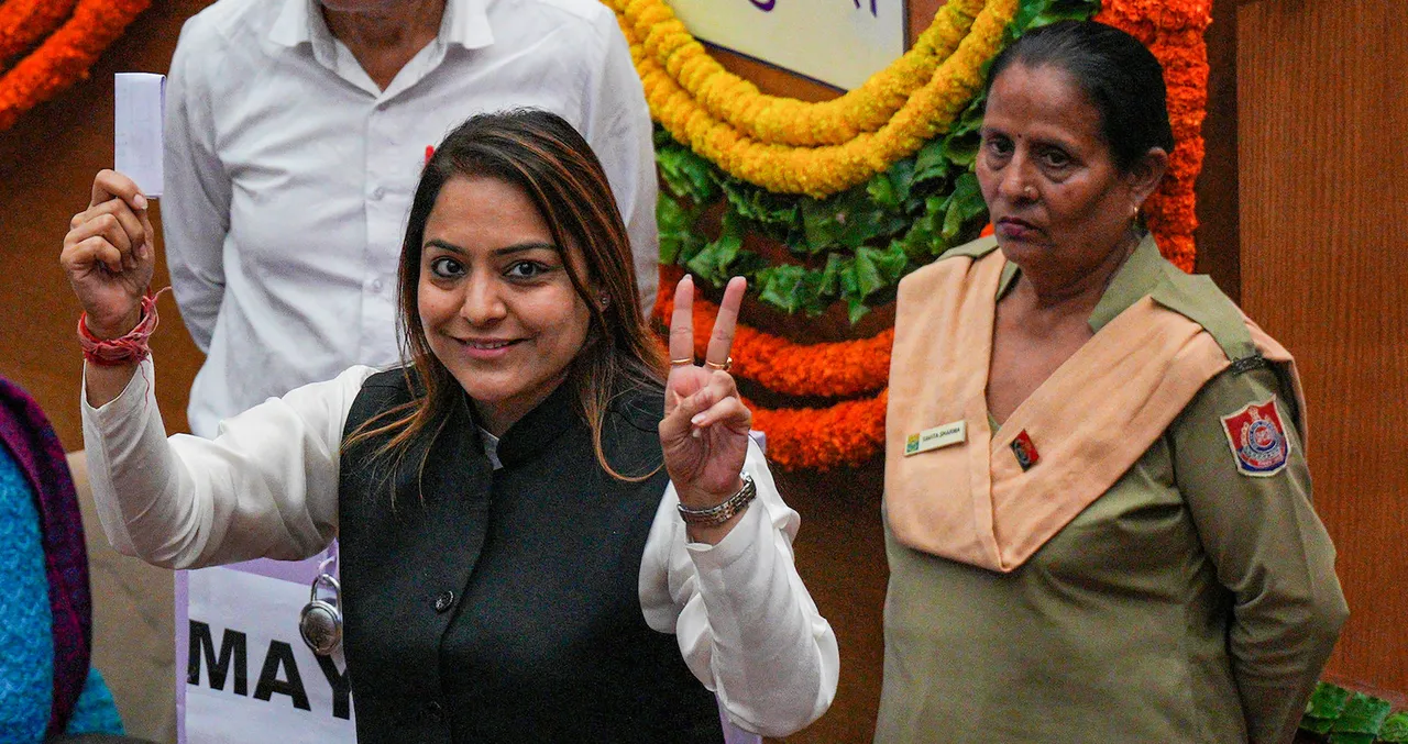 AAP Mayor candidate Shelly Oberoi flashes victory sign after casting her vote during the election of Mayor and Deputy Mayor of MCD