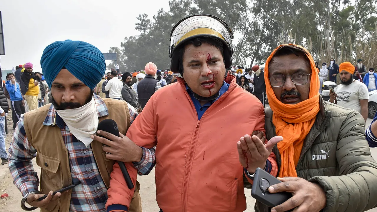 An injured Aaj Tak journalist being assisted during the farmers' 'Delhi Chalo' march at Punjab-Haryana Shambhu border