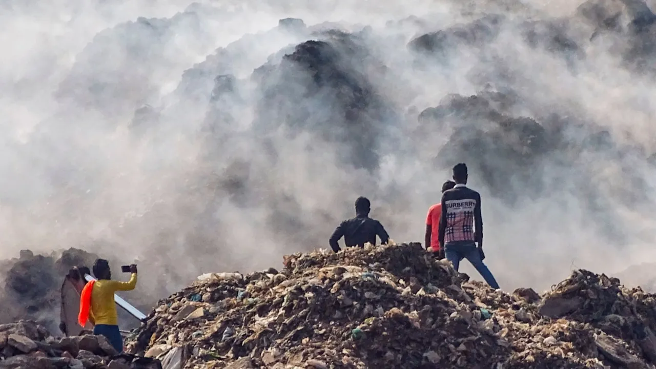 Smoke rises after a fire broke out at the Ghazipur landfill site on Sunday, in New Delhi, Monday, April 22, 2024